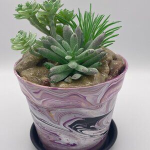 Acrylic paint pour pot with artificial succulents.